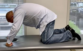 Chiropractor Knoxville TN Josh Rucker Demonstrating Stretch For Lower Crossed Syndrome