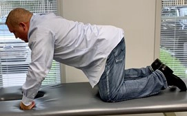 Chiropractor Knoxville TN Josh Rucker Demonstrating Stretch For Lower Crossed Syndrome